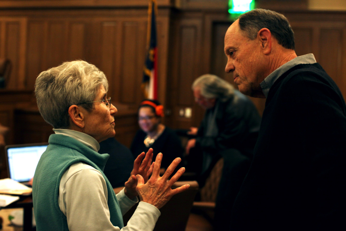 Mary Lucas, a local critic of Chatham Park, questions developer Tim Smith at a public meeting.